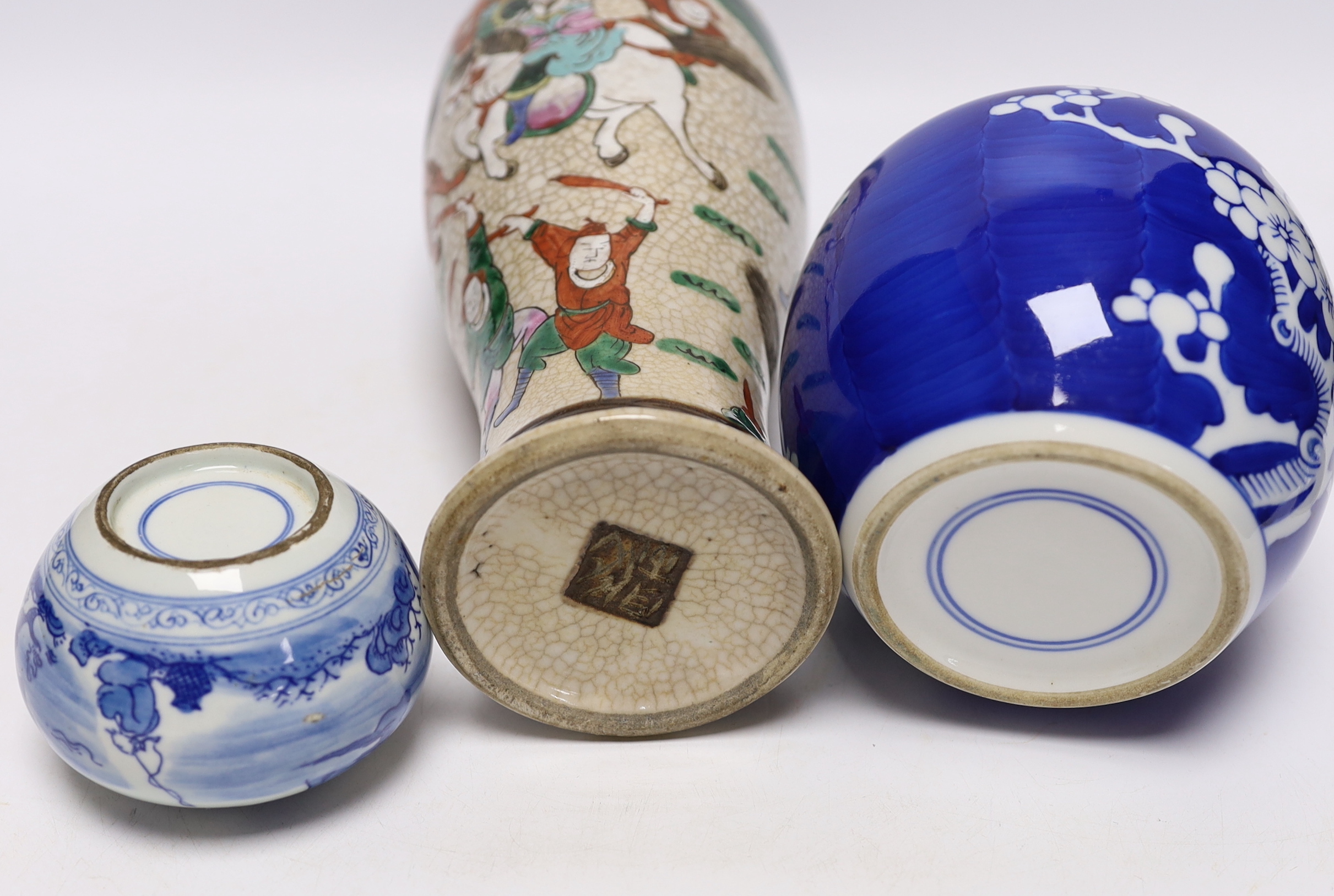 An early 20th century Chinese crackle glaze vase and two blue and white jars, largest 30cm high